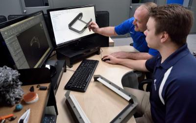 Lauren International staff working on computer